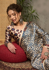 A cream-colored silk saree with a geometric ajrak print.