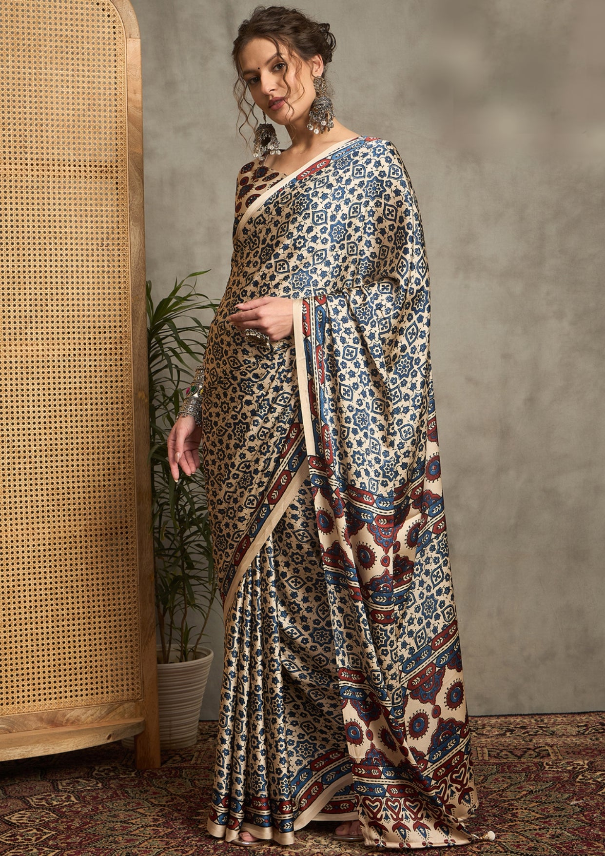 A cream-colored silk saree with a geometric ajrak print.