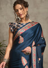 A blue saree with red and white floral ajrak print 
