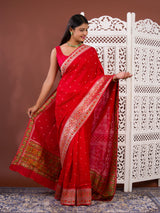 A red saree with white patternsBanarasi Zari Weaving Saree