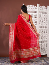 A red saree with white patternsBanarasi Zari Weaving Saree