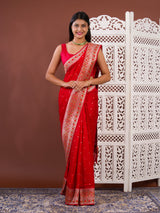 A red saree with white patternsBanarasi Zari Weaving Saree