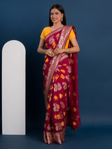 A maroon saree with gold patterns withDola Silk Bandhani Zari Weaving Work 