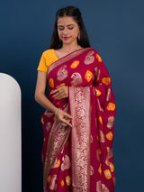 A maroon saree with gold patterns withDola Silk Bandhani Zari Weaving Work 