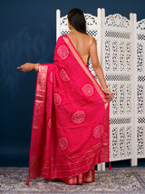 A pink and gold Upada silk saree with Bandhani style embellishments and Zari work, 