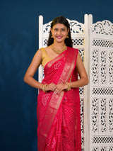 A pink and gold Upada silk saree with Bandhani style embellishments and Zari work, 