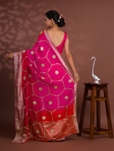 A pink and orange saree with Gota Patti Work