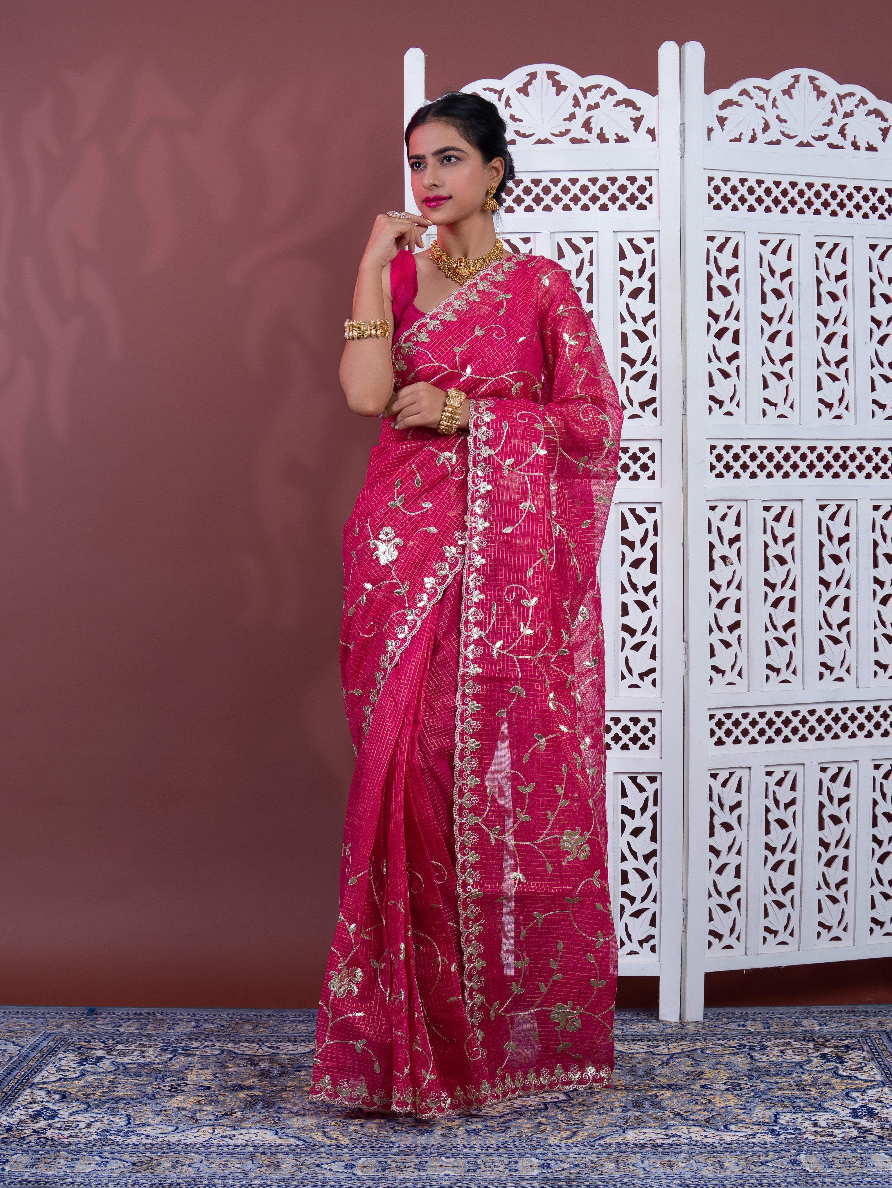 A pink saree with white patternsKota Doriya Gota Patti Work Saree