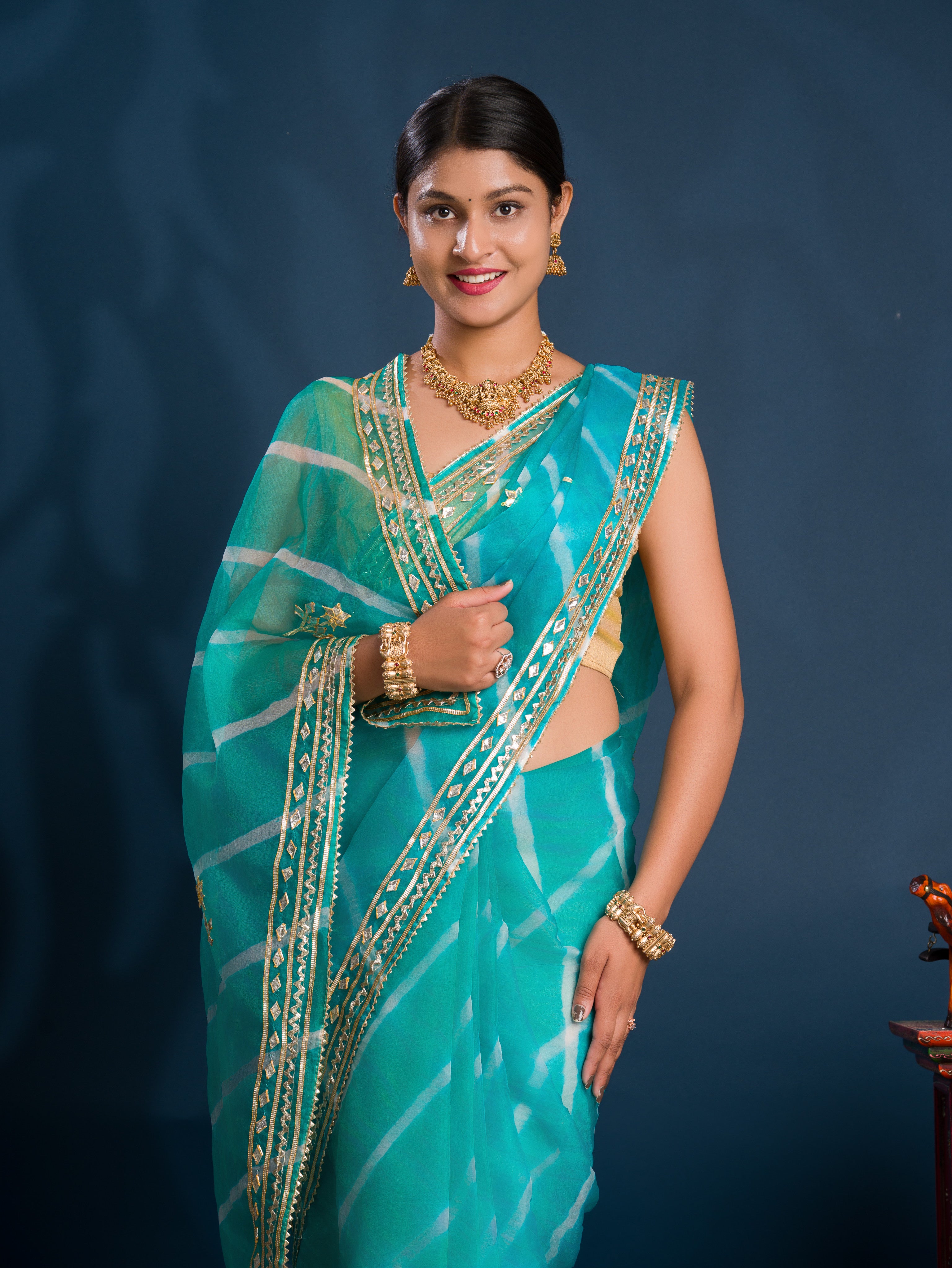 Teal sareewith Silverpatterns Organza Leheriya Style With Gotapatti Work 
