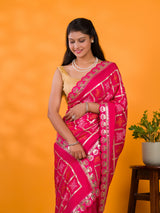 A pink saree with white patterns withCotton silk Bandhani Gotapatti Work Saree