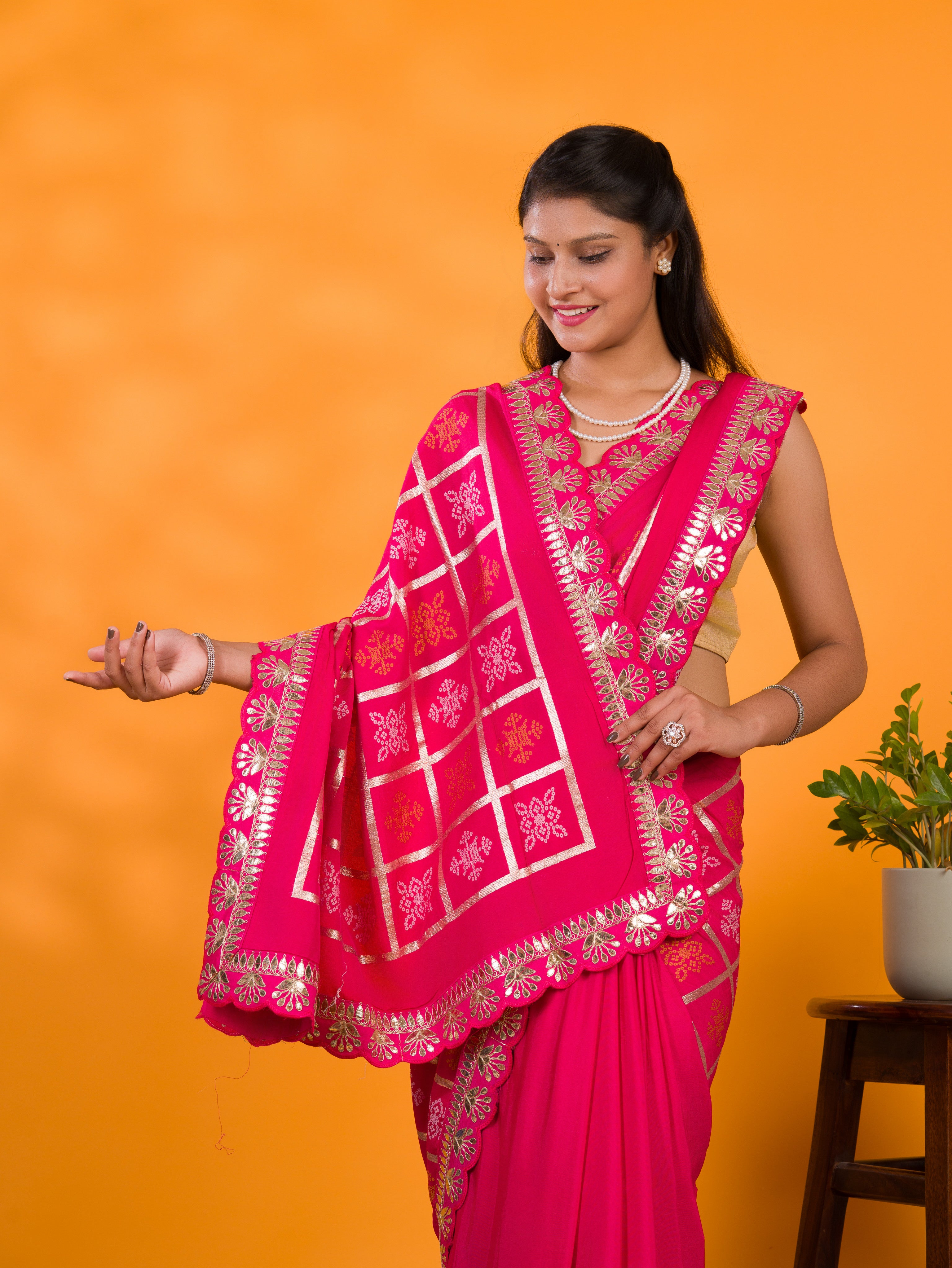 A pink saree with white patterns withCotton silk Bandhani Gotapatti Work Saree