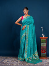 A teal saree with floral patternsBanarasi Silk Printed Style With zari weaving Work Saree 