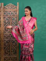 A saree with a kalamkari style pattern in pink colors, with zari weaving and a Banarasi border.