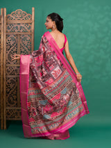 A saree with a kalamkari style pattern in pink colors, with zari weaving and a Banarasi border.