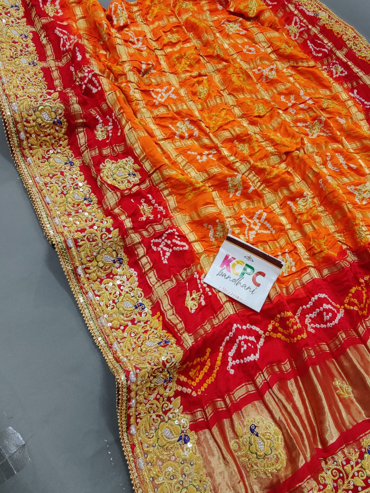 KcPc Trending Pure Gaji Silk Bandhani Jardozi Work Ghatchola Odhna in Aara Tari Handwork Pila (Red Orange)