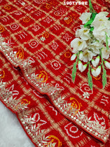 A red Gaji silk Bandhani saree Gota patti work