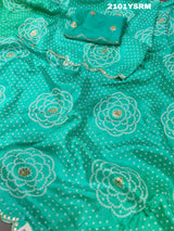 A green modal silk bandhani saree with pitan gotapatti work 