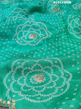 A green modal silk bandhani saree with pitan gotapatti work 