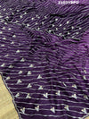A purple dola silk saree with pearl gotapatti work