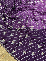 A purple dola silk saree with pearl gotapatti work 