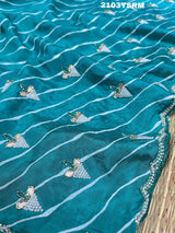 Ablue and white Dola silk saree with pearl embellishments and gota work 