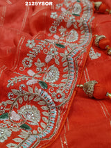 A red saree with silver and gold sequence cutdana work pattern.