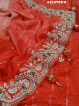 A red saree with silver and gold sequence cutdana work pattern.