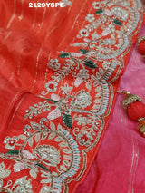 red saree with golden and silver embellishments and cutdana work, showcasing a traditional and festive design.