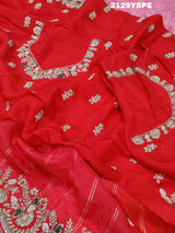 red saree with golden and silver embellishments and cutdana work, showcasing a traditional and festive design.