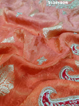 An orange saree with silver paisley pattern and floral gotapatti work, along with sequence embellishments.