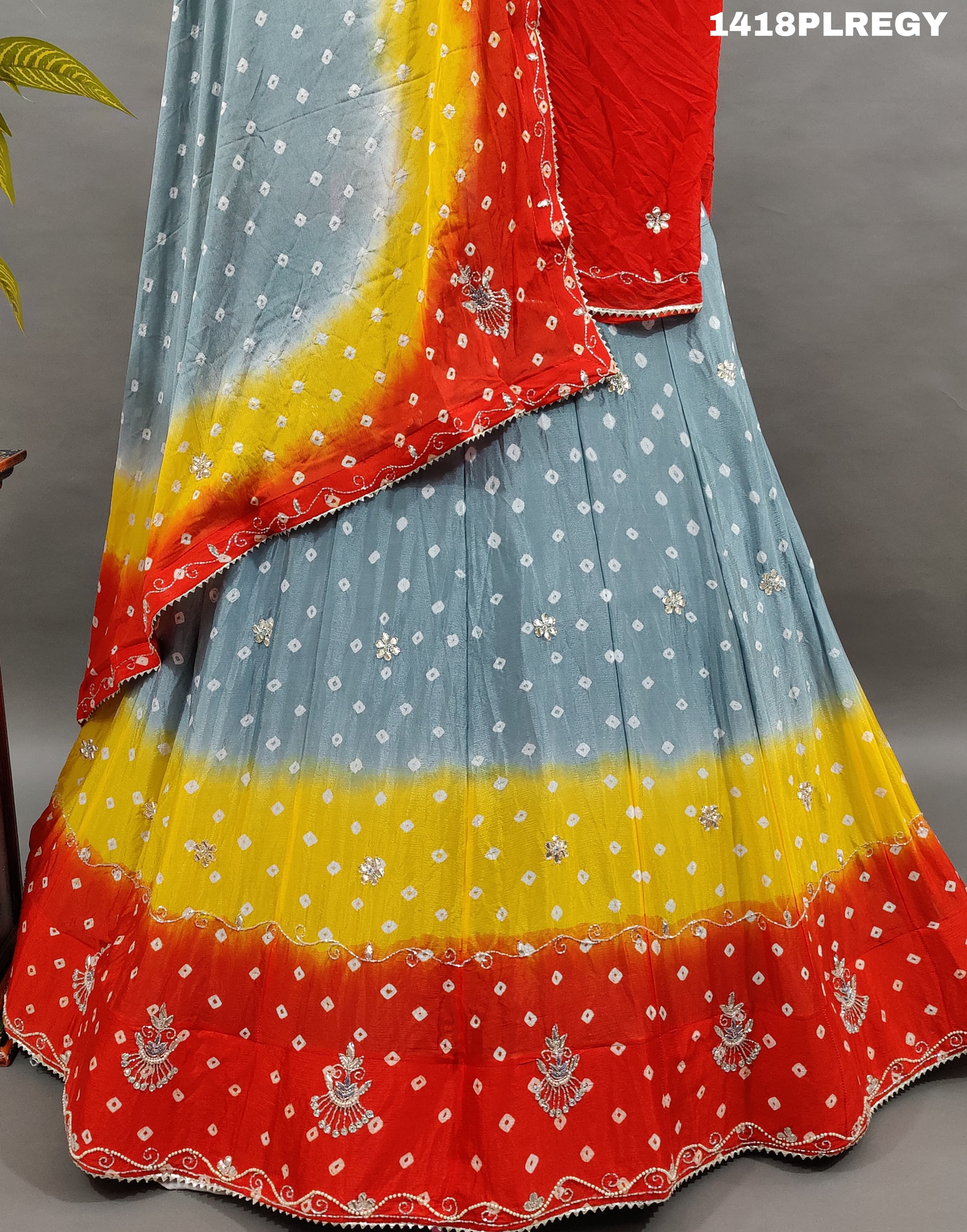 A traditional Indian lehenga with multicolor bandhani