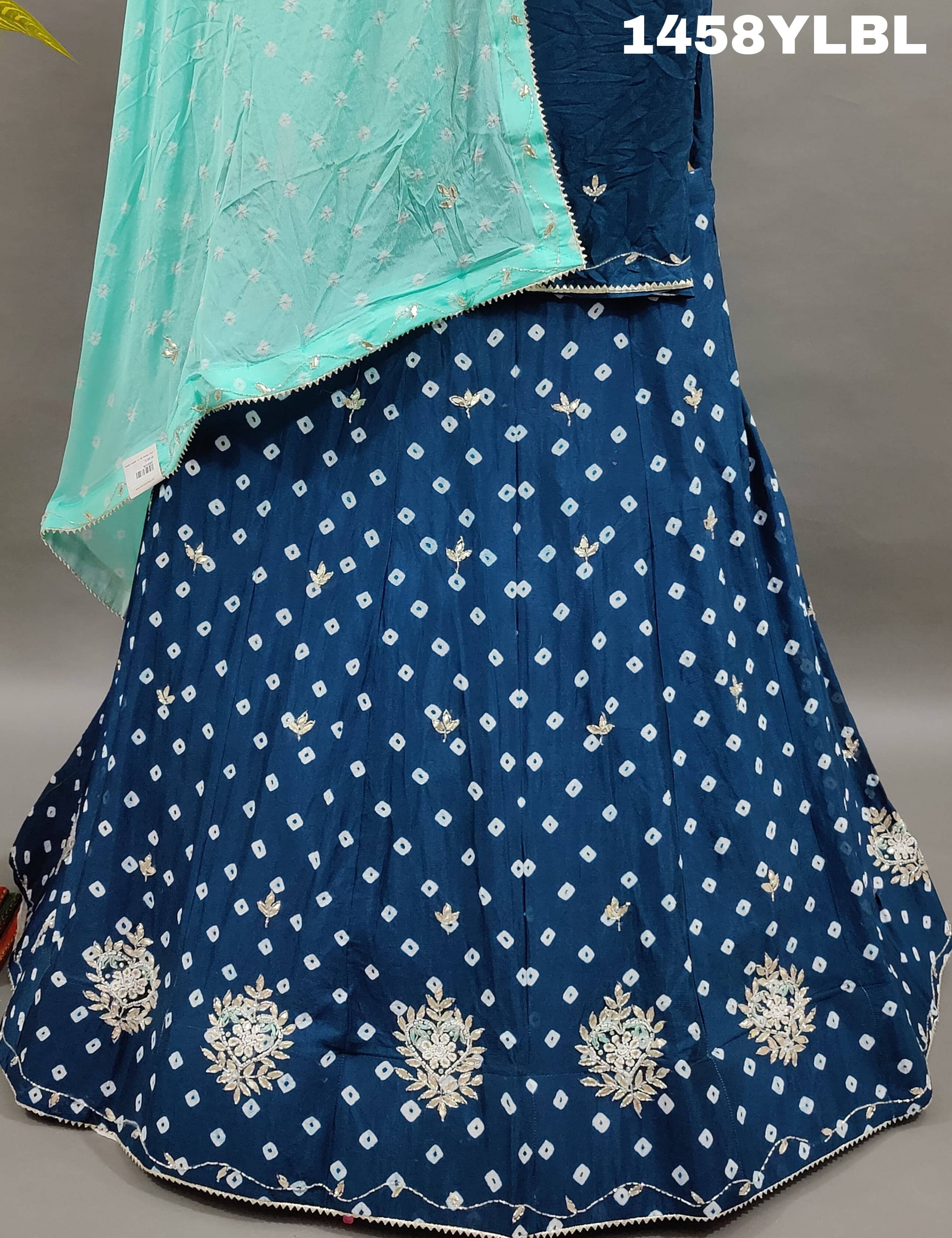 A traditional blue lehenga with bandhani style and cutdana work
