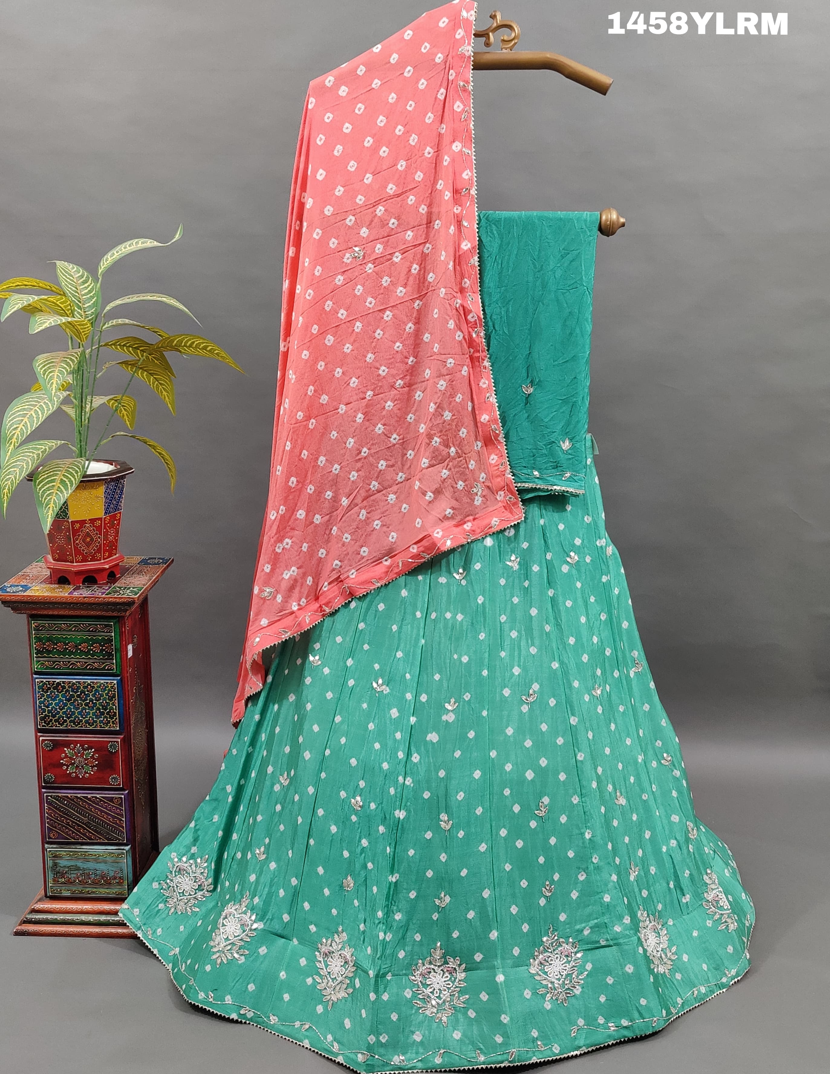 Alehenga with Bandhani style and cutdana work. 