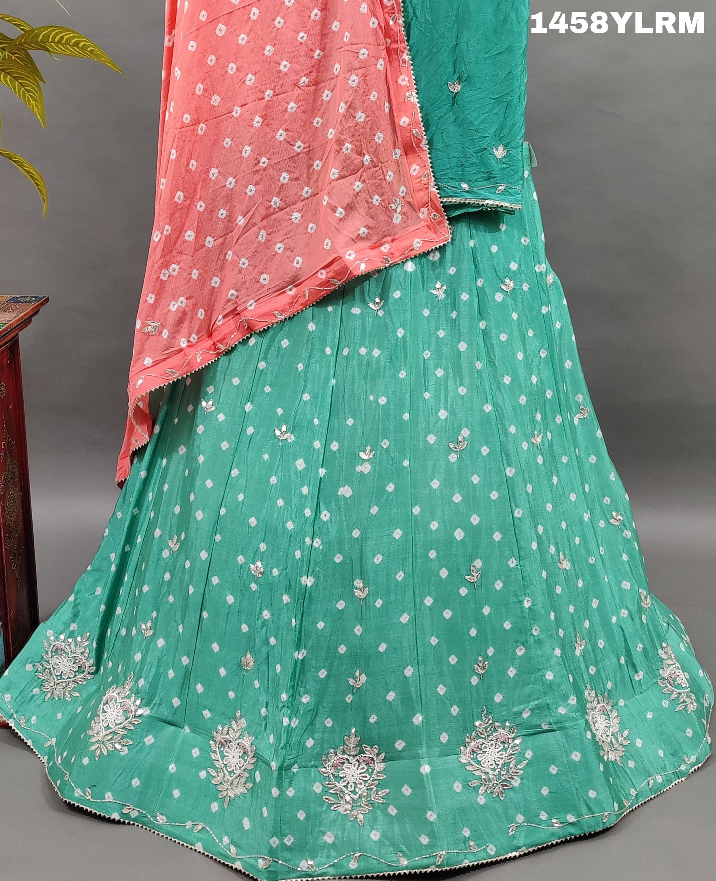 Alehenga with Bandhani style and cutdana work. 
