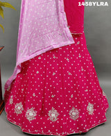 A traditional wear lehenga in pink color with bandhani style 