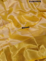 A yellow and gold tissue silk saree with Banarasi zari border