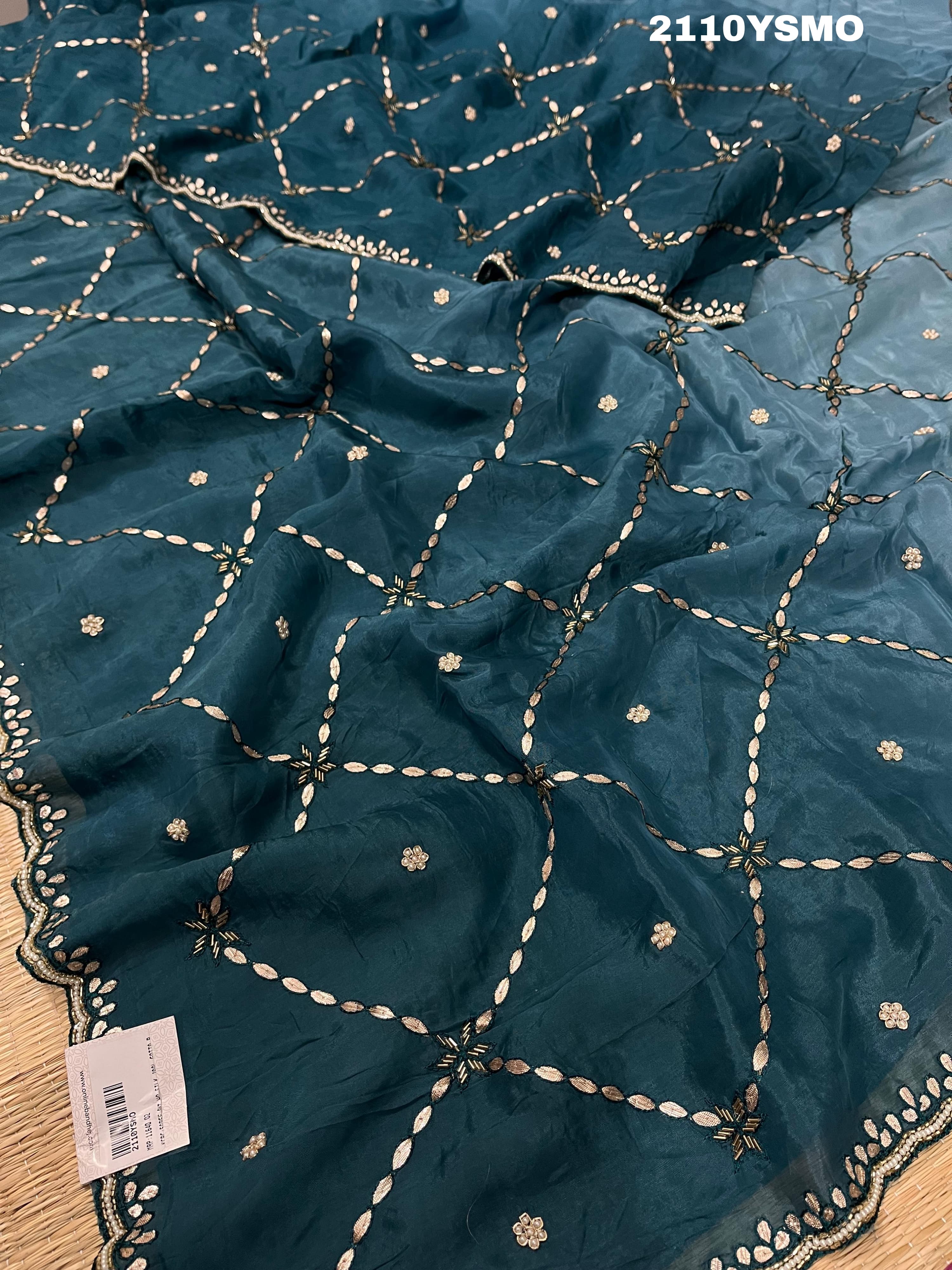 A blue saree with geometric gotapatti work embroidery 