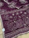 A purple saree with detailed gold Gota patti work 
