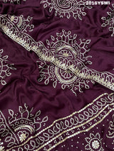 A purple saree with detailed gold Gota patti work 