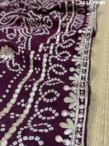 A purple saree with detailed gold Gota patti work 
