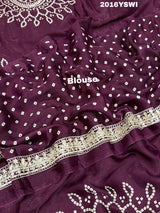 A purple saree with detailed gold Gota patti work 
