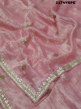 A saree with tissue silk fabric featuring Bollywood style embellishments and gotapatti work in red and pink colour