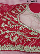 A saree with tissue silk fabric featuring Bollywood style embellishments and gotapatti work in red and pink colour