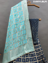 A traditional Indian lehenga with a blue and silver silk base and detailed cutdana work