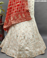 A Lehenga with white beads work and red and orange dupatta