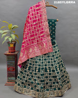 A traditional wear lehenga with Dola Silk Banarasi style embellished with white beads