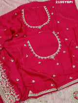 A pink tissue silk saree with traditional sequence Gotapatti work.