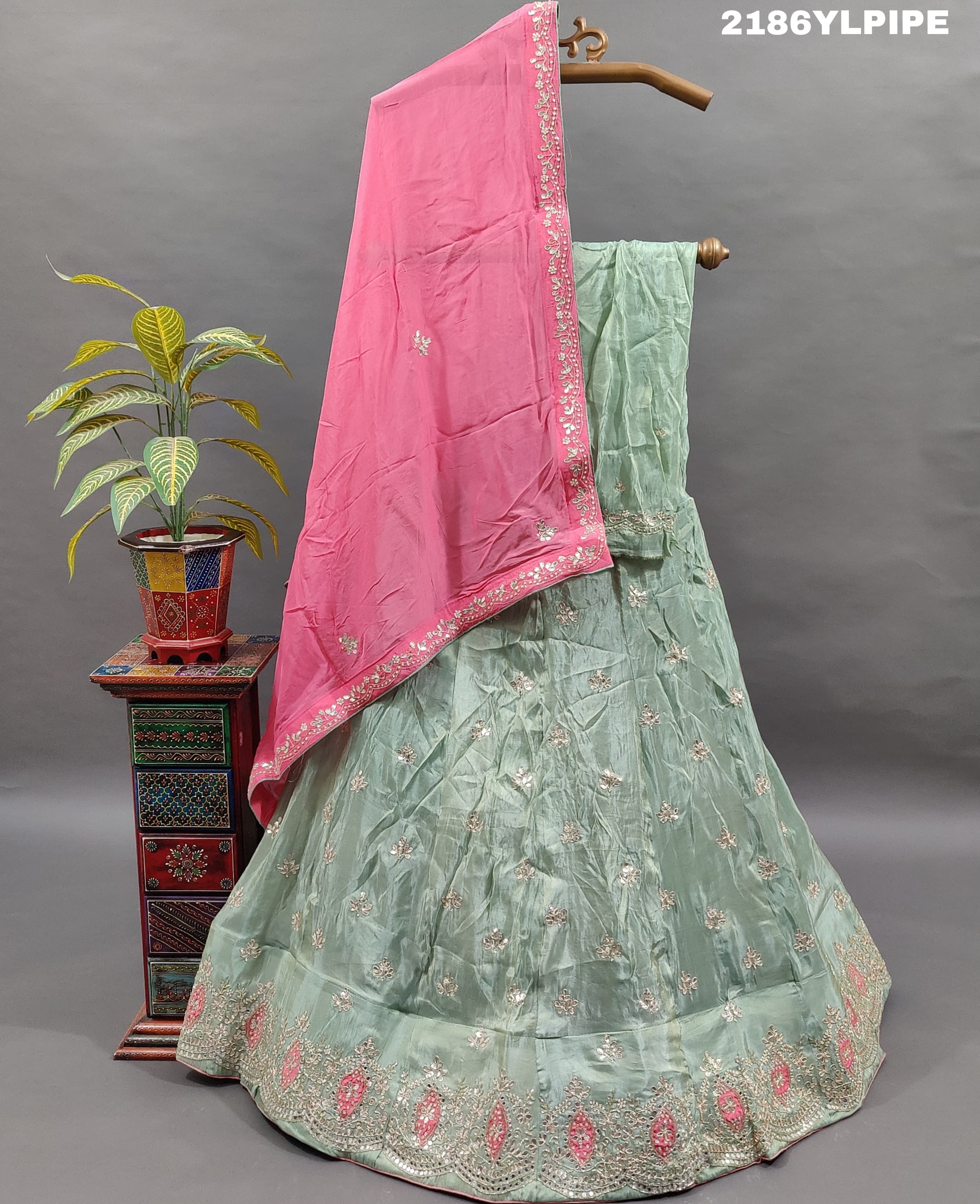 A traditional Indian lehenga with cutdana and gotapatti work.