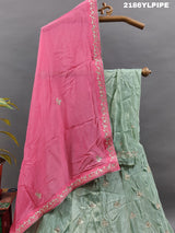 A traditional Indian lehenga with cutdana and gotapatti work.