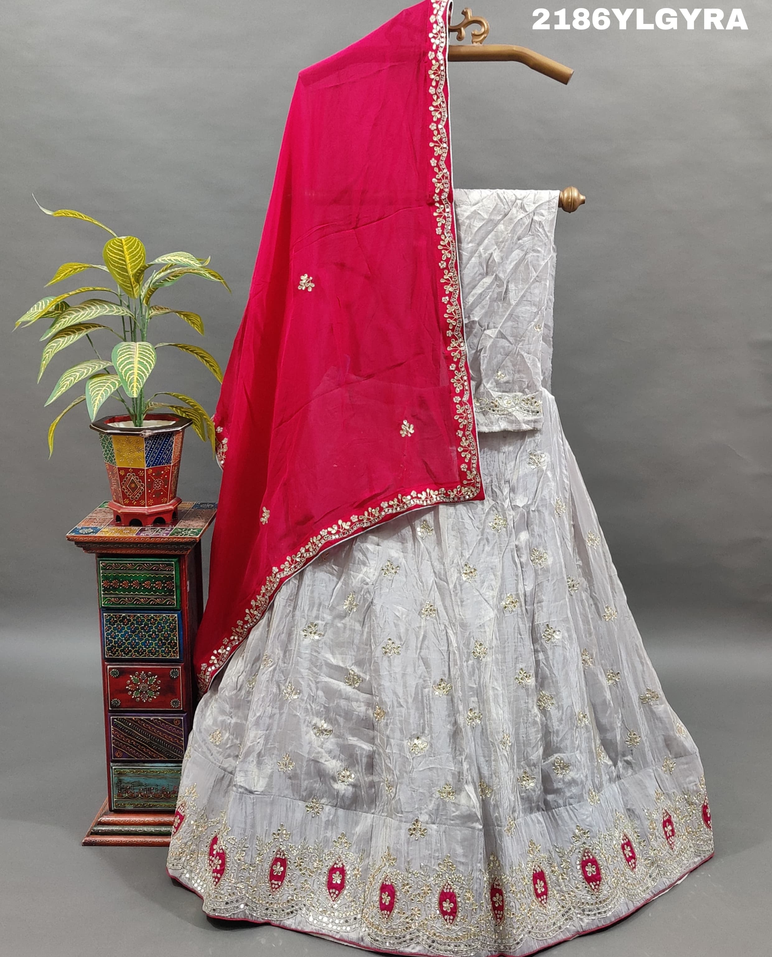 A Bollywood style Upada silk lehenga with cutdana and gotapatti work